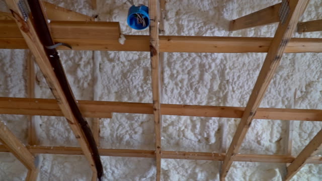 Interior-of-the-frame-house-in-construction-of-termal-insulation-installing-at-the-attic-the-roof