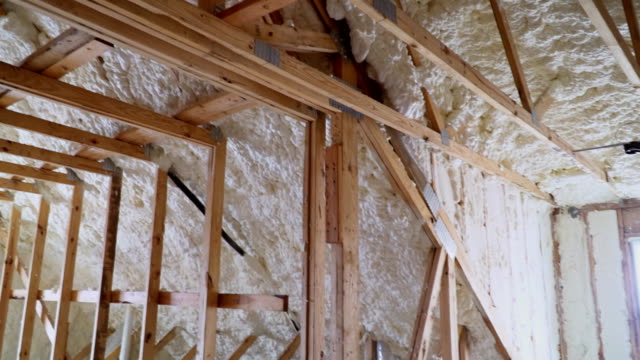 New-home-construction-with-installation-of-termal-insulation-installing-at-the-attic-the-roof