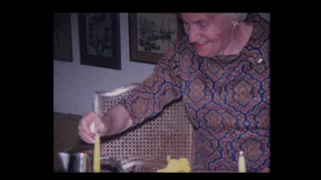 1971-Elderly-woman-lights-candles-to-start-Passover-seder