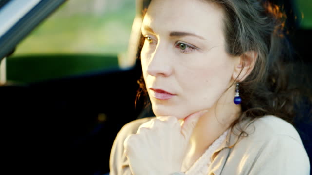 Portrait-of-Caucasian-woman-crying-in-car.-Tears-rolling-down-her-cheeks,-close-up.-Concept---problems-of-relationships,-women's-problems