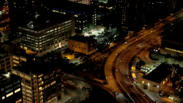 AERIAL:-Brooklyn-Bridge-boulevard-and-lit-up-with-lights-Brooklyn-city-at-night