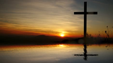 Cross-of-Jesus-Christ-near-Water-with-Sunset-and-Peaceful-Mood.