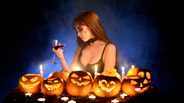Woman-with-Halloween-pumpkins