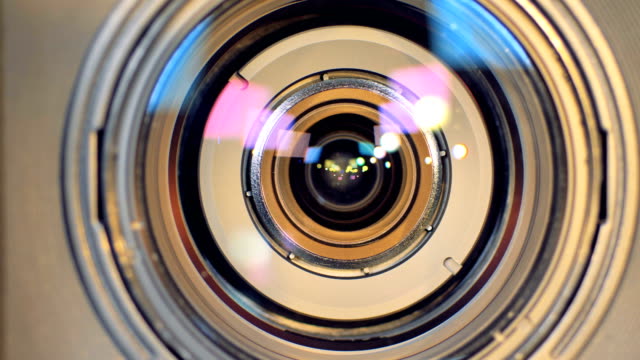 A-macro-view-on-a-camera-lens-and-a-zoom-button.