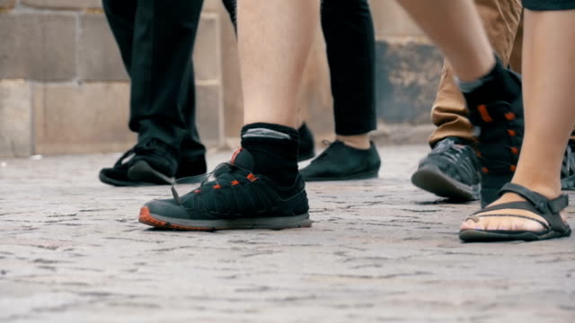 Feet-of-Crowd-People-Walking-on-the-Street-in-Slow-Motion