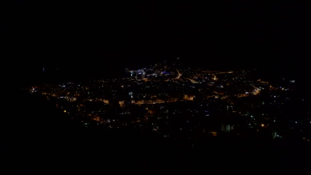Panoramic-shot-of-The-City-of-Budva-at-night