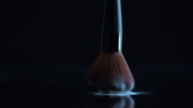 Powder-brush-fall-slow-motion-on-the-black-background.
