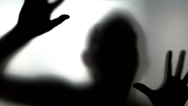Scary-human-behind-frosted-glass-in-4k-slow-motion-60fps