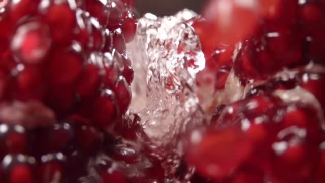 Water-flow-between-pomegranate-grains.-Slow-motion