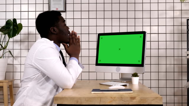 Shocked-medical-doctor-looking-on-the-screen-of-computer.-White-Display