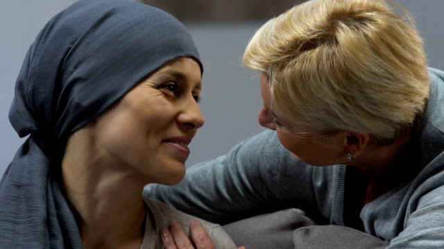 Mother-kissing-loving-daughter-with-cancer,-supporting-during-chemotherapy