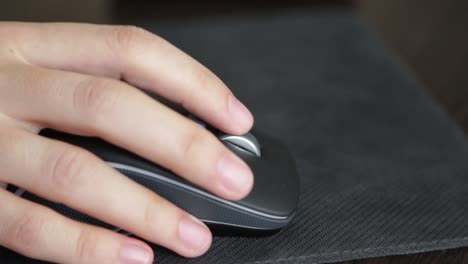 black-wireless-computer-mouse-in-a-hand.