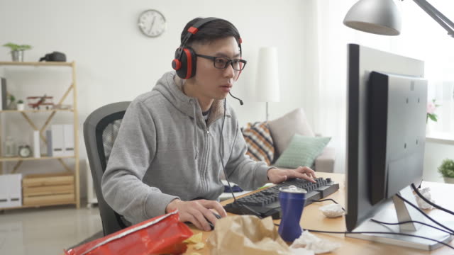 Young-man-playing-computer-game-concentrated
