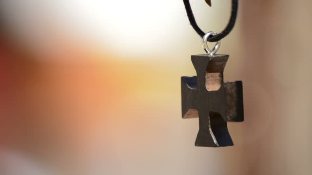Wooden-Cross-in-Leather-Necklace-Hanging
