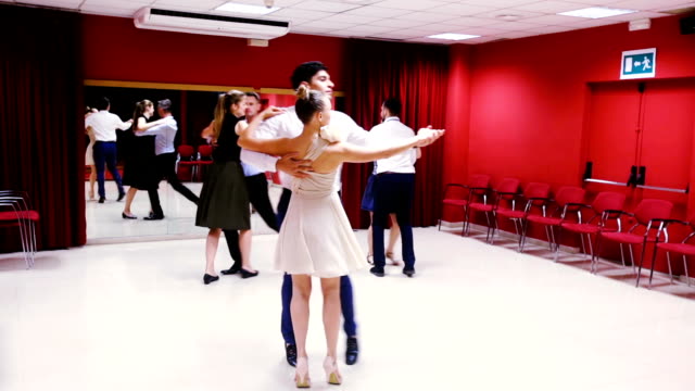 men-and-women-enjoying-of-partner-dance
