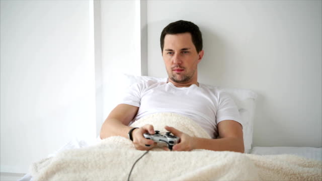 Man-spending-free-time-with-playing-video-games-at-home