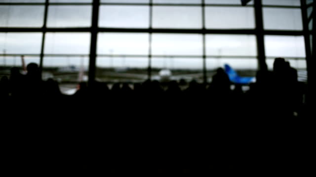 Defocused-airport-background,-Silhouette-People-walking-on-the-background.