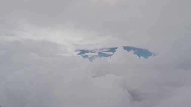 Aerial-view-footage.-Airplane-flying-through-the-clouds.-Pilot’s-view