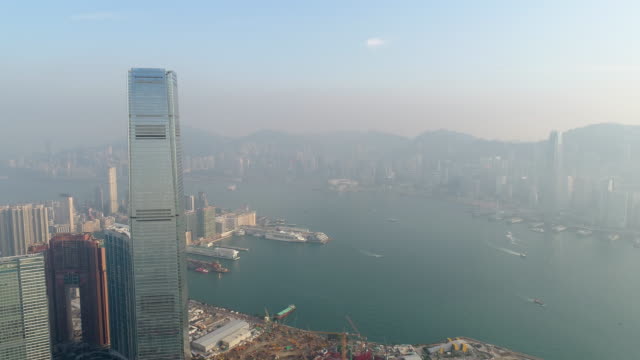 China-sol-luz-famoso-hong-kong-edificio-panorama-aéreo-construcción-Bahía-4k