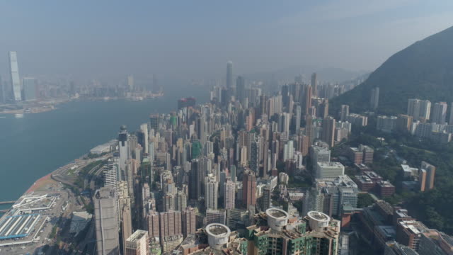China-día-soleado-hong-kong-ciudad-selva-Bahía-kowloon-aérea-panorama-4k