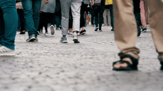 Legs-of-Crowd-People-Walking-on-the-Street
