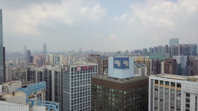 China-día-tiempo-guangzhou-ciudad-tejados-centro-aéreo-panorama-4k