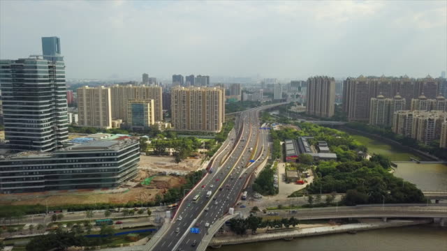 día-tiempo-guangzhou-paisaje-urbano-tráfico-liede-Puente-Río-Perla-china-de-panorama-aéreo-4k