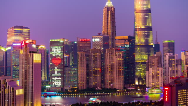 puesta-de-sol-de-Shangai-Bahía-noche-iluminada-en-la-azotea-panorama-4k-timelapse-china