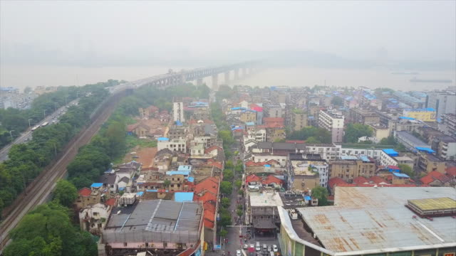 china-day-time-wuhan-city-traffic-changjiang-bridge-living-block-aerial-top-view-4k