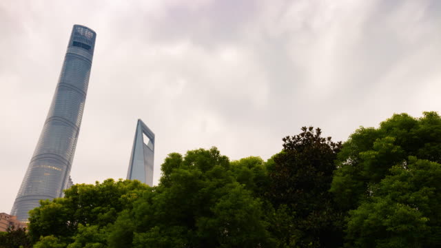 rainy-day-shanghai-city-famous-megatalls-buildings-top-sky-panorama-4k-time-lapse-china