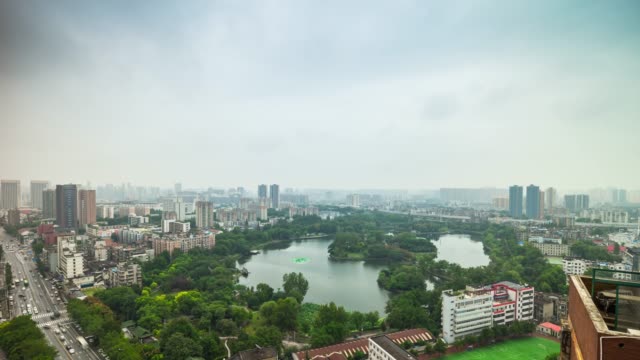day-light-wuhan-cityscape-park-lake-traffic-rooftop-panorama-4k-time-lapse-china