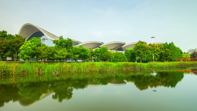sunny-day-wuhan-city-main-railway-station-front-park-lake-panorama-4k-time-lapse-china