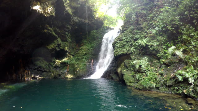 Mountain-waterfall-flowing-between-rocks