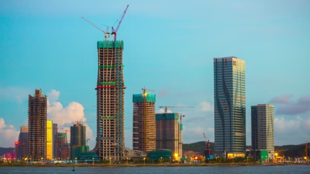China-zhuhai-atardecer-soleado-Bahía-Macao-ciudad-Hoteles-construcción-costa-panorama-4k-timelapse