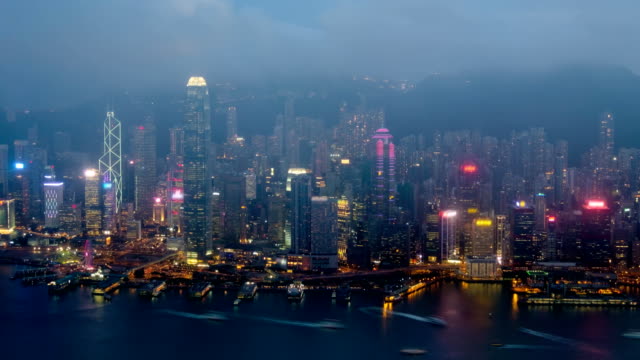 Day-to-night-timelapse-of-illuminated-Hong-Kong-skyline.-Hong-Kong,-China