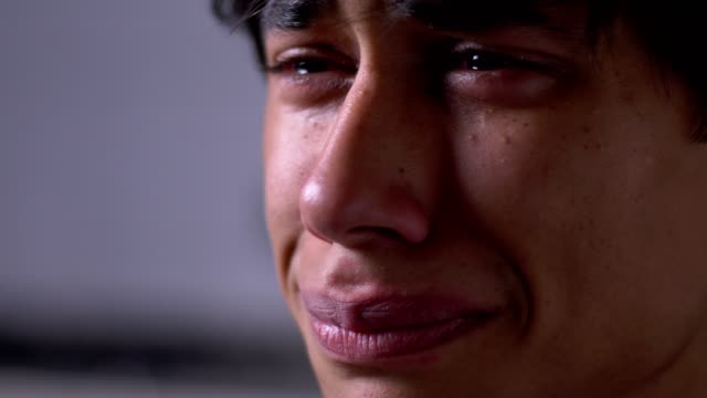 young-sad-man-with-broken-heart-crying--close-up