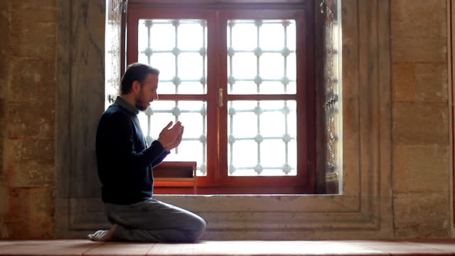 Young-muslim-praying-in-mosque
