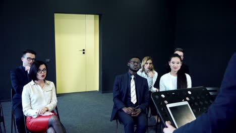 Attentive-young-audience-in-a-business-meeting