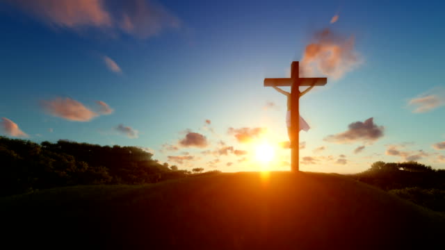 Silhouette-of-Jesus-with-Cross-over-sunset,-religious-concept