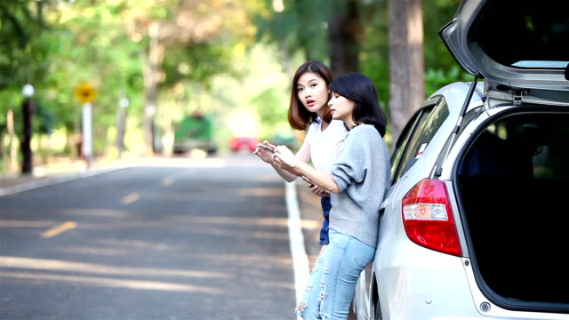 Two-woman-have-car-trouble-waiting-for-help