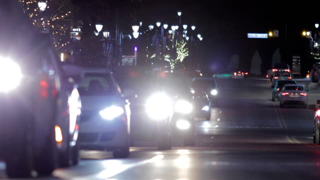 Holiday-Traffic-at-Night-with-Pedestrians-Crossing-Street