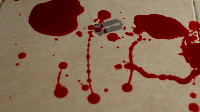 Blood-dripping-onto-tile,-attempt-to-commit-suicide-with-sharp-blade,-depression