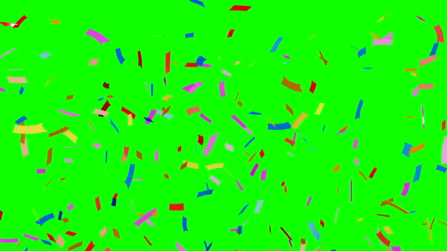 Multi-colored-confetti-falling-on-green.