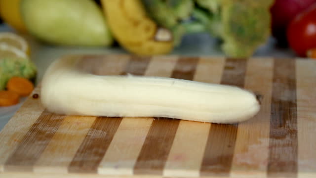 Banana-falls-on-cutting-board-in-slow-motion