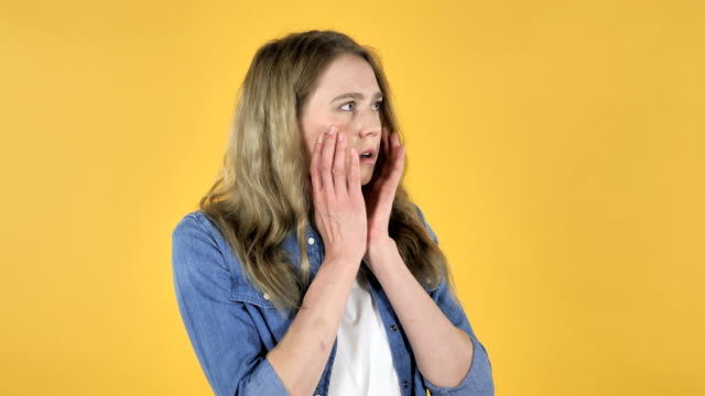 Pretty-Girl-Confused-and-Scared-of-Problems-on-Yellow-Background