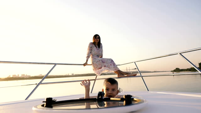 Mom-and-baby.-Mom-and-baby-are-sailing-on-a-yacht.