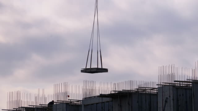 Building-construction.-A-Crane-on-a-Construction-Site-Lifts-a-Load