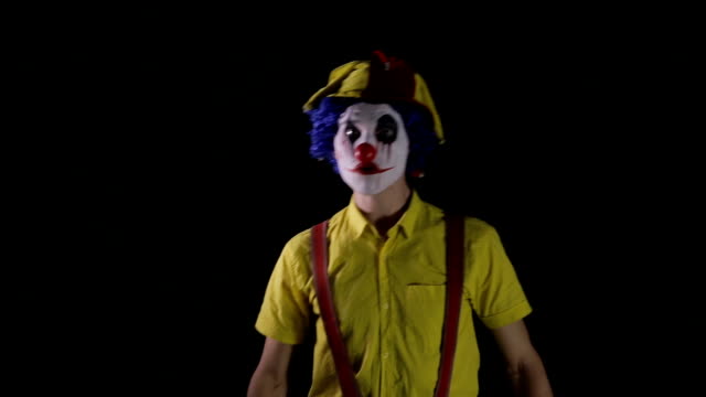 A-scary-clown-makes-fast-head-and-torso-movements.