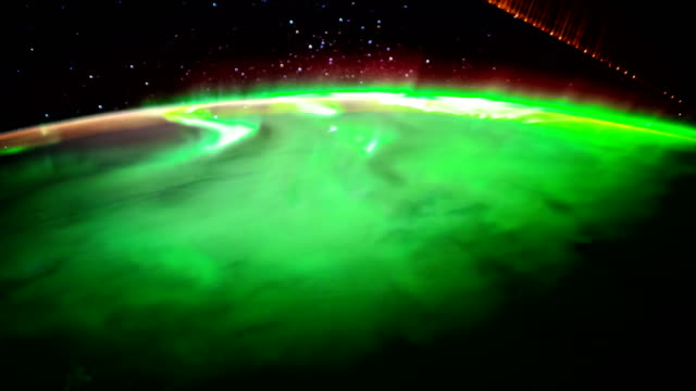 Earth-and-Aurora-Borealis-from-ISS.-Elements-of-this-video-furnished-by-NASA.-8K-Timelapse