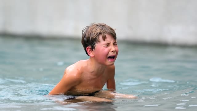 Child-crying-in-real-pain.-Child-in-agony-after-having-been-physically-hurt-at-the-pool.-Young-boy-cries-uncontrollably